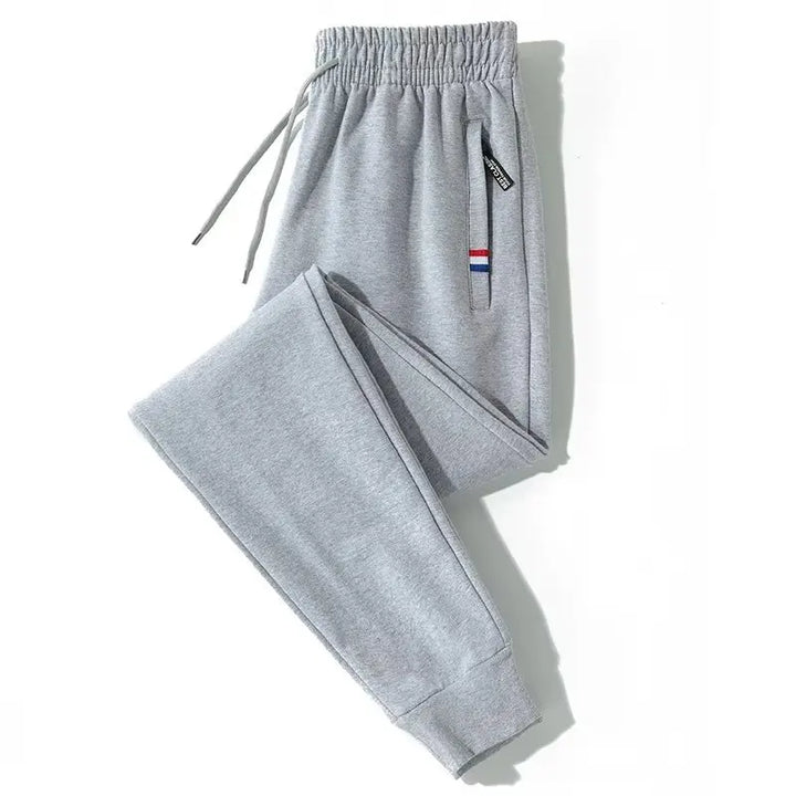 Men's elastic loose sports pants for spring and autumn, thin men's pants, leg binding pants, casual pants, sanitary pants